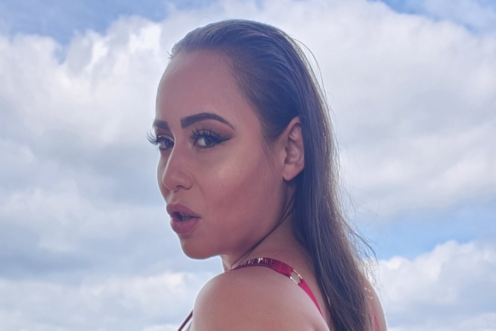 Carmela Clutch Eases Tension with Will Tile in New Video